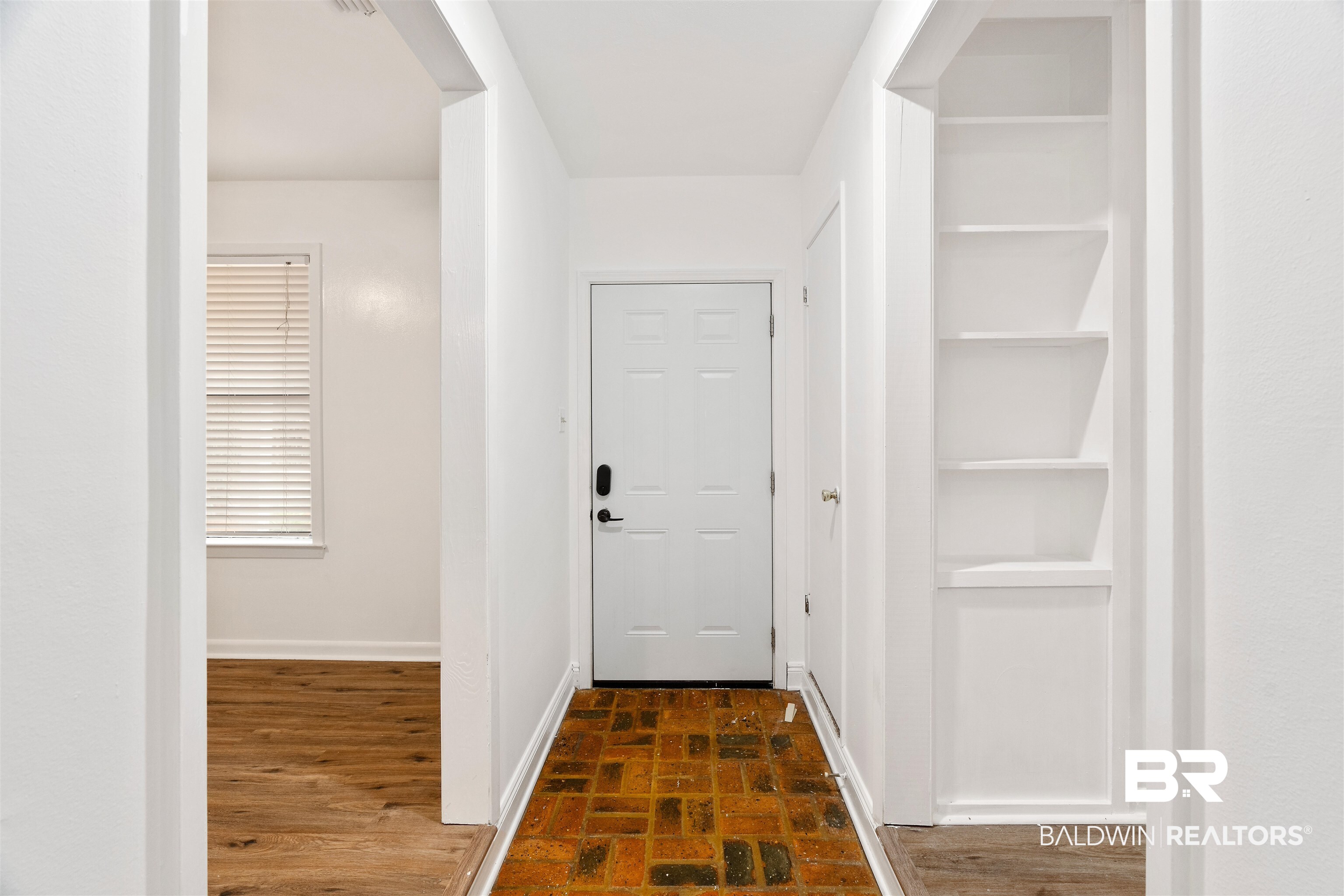 159 Montclair Loop Daphne, AL 36526 - Photo 2 of 18 Entryway featuring brick flooring and baseboards