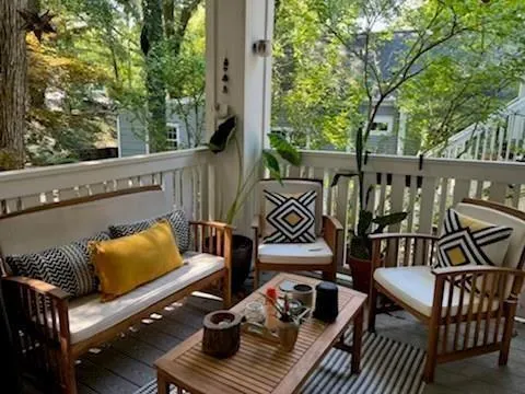 a view of chairs and deck in the balcony
