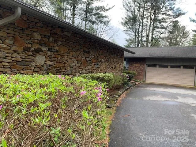 a backyard of a house with lots of green space
