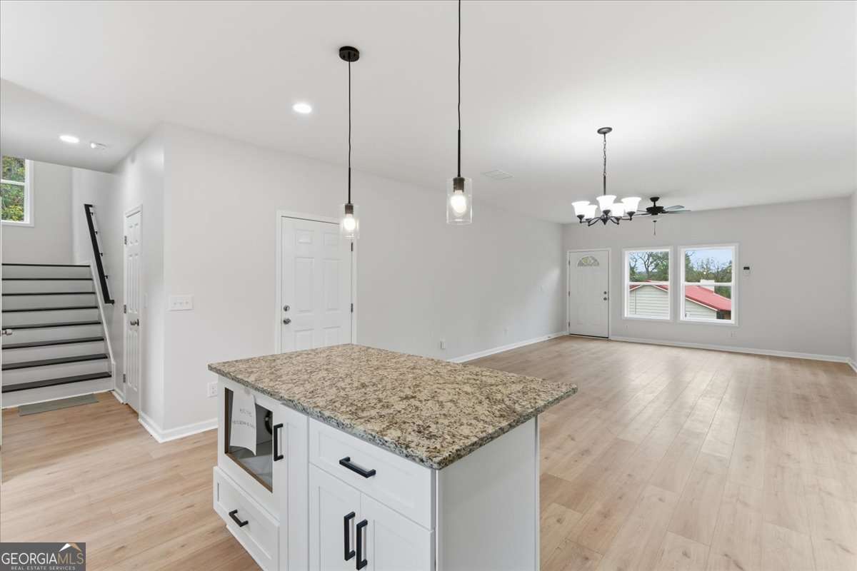119 Jackson Street Northeast Rome, GA 30161 - Photo 16 of 57 a view of a kitchen and living room