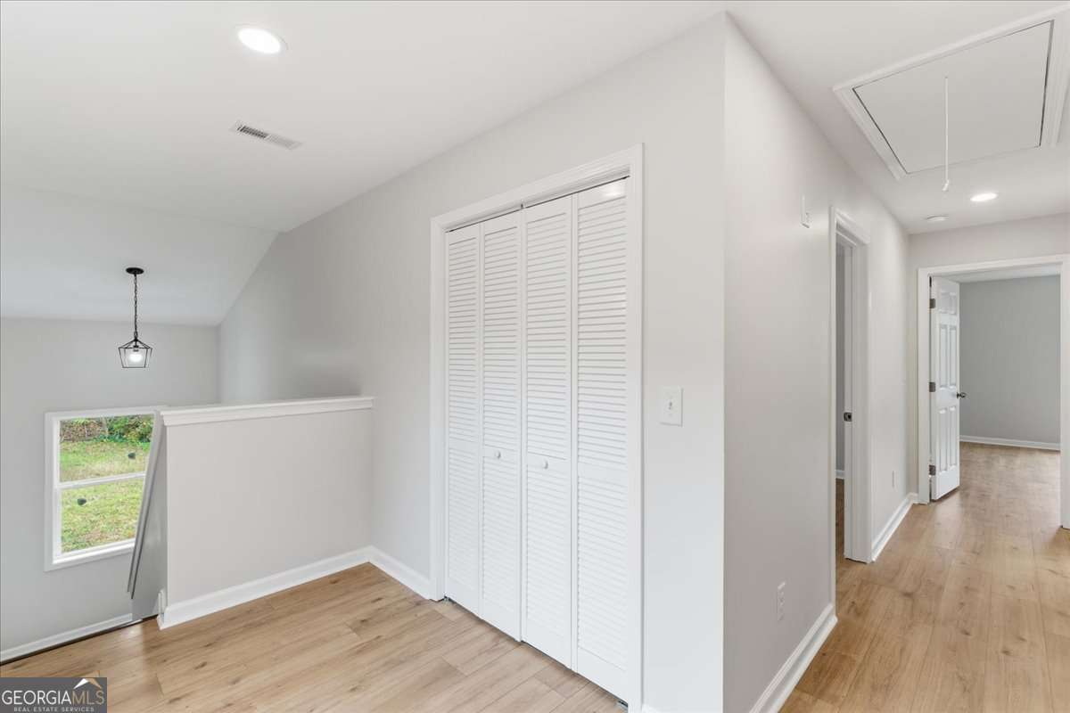 119 Jackson Street Northeast Rome, GA 30161 - Photo 24 of 57 a view of a hallway with wooden floor and closet area