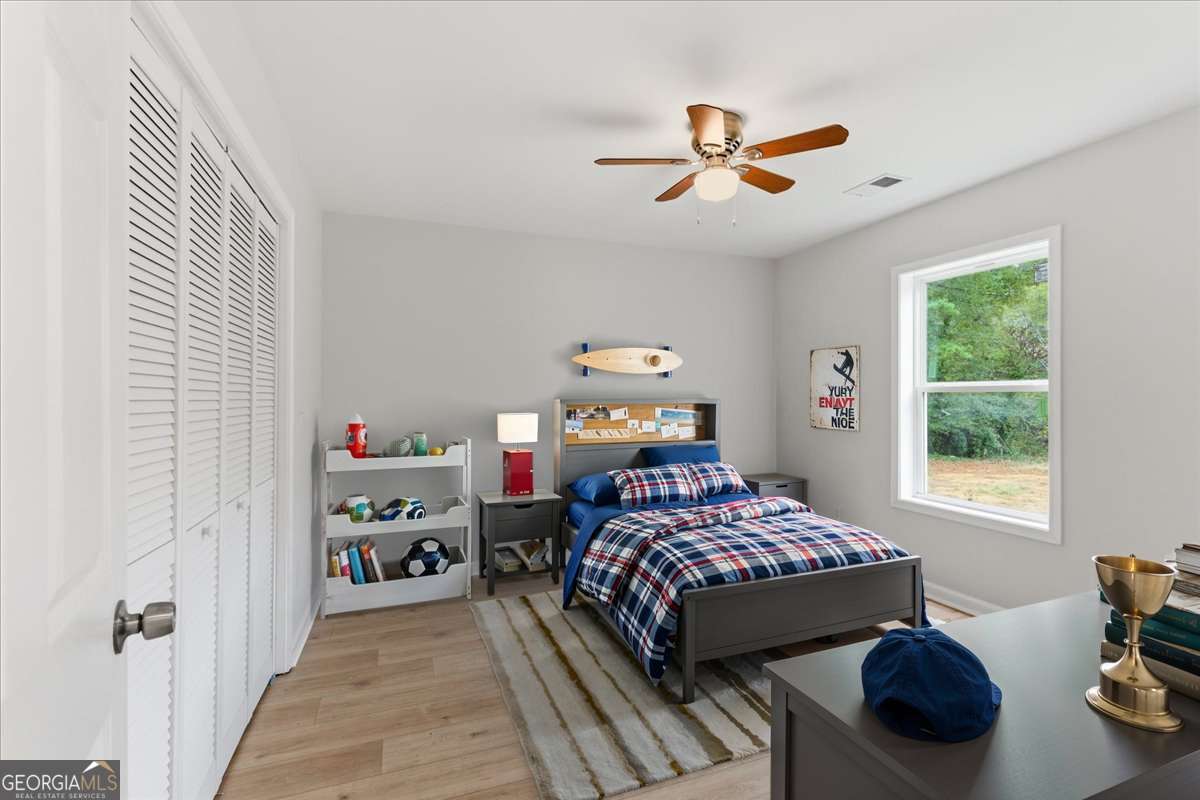 119 Jackson Street Northeast Rome, GA 30161 - Photo 26 of 57 a bedroom with a bed and a window