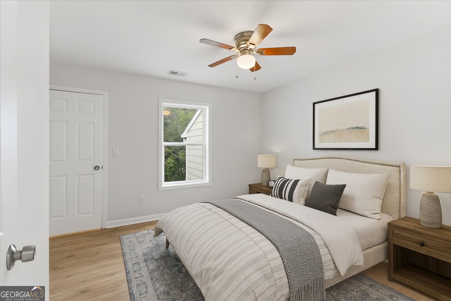 119 Jackson Street Northeast Rome, GA 30161 - Photo 29 of 57 a bedroom with a large bed and a window