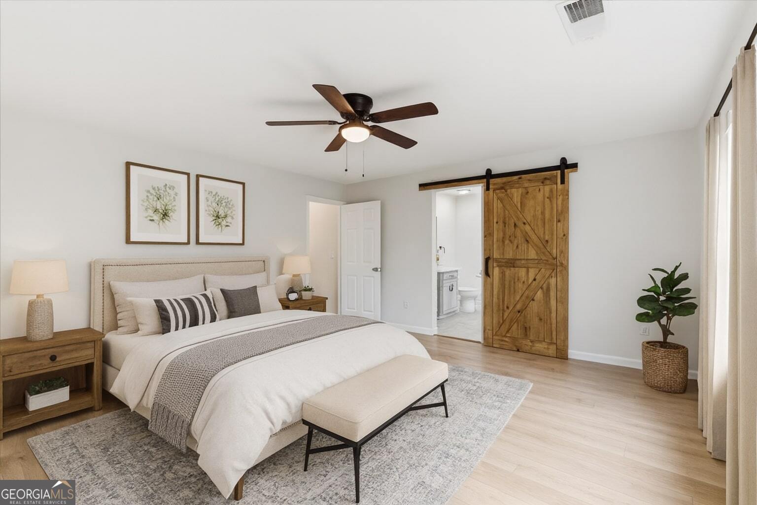 119 Jackson Street Northeast Rome, GA 30161 - Photo 35 of 57 a bedroom with a bed and a chandelier