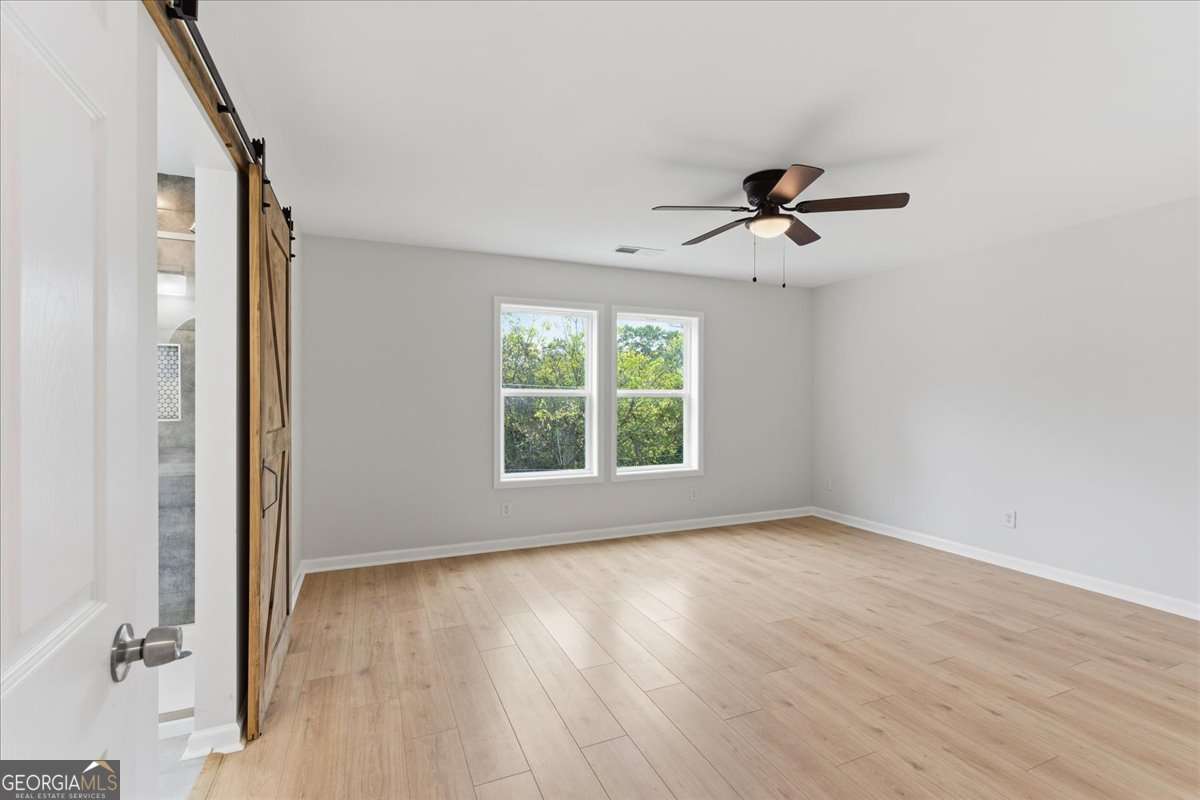119 Jackson Street Northeast Rome, GA 30161 - Photo 37 of 57 a view of room with window ceiling fan and hardwood floor