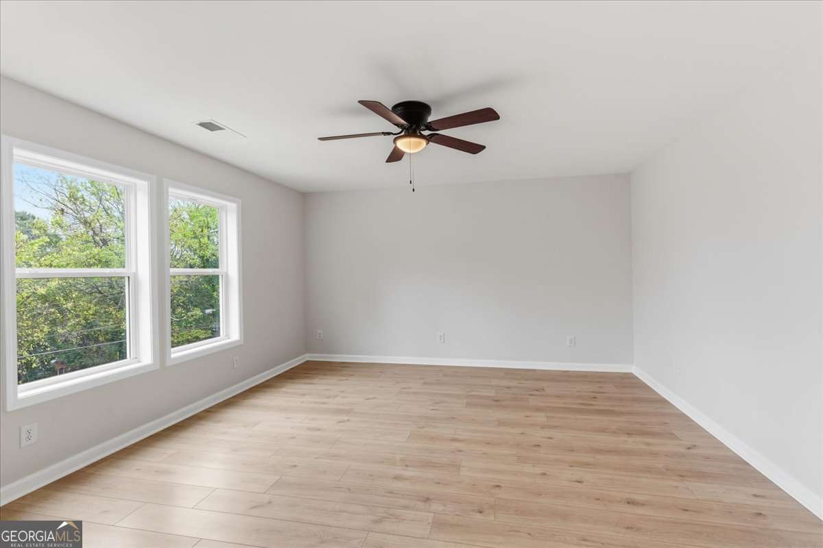 119 Jackson Street Northeast Rome, GA 30161 - Photo 39 of 57 wooden floor in an empty room with a window