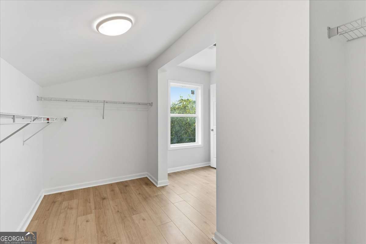 119 Jackson Street Northeast Rome, GA 30161 - Photo 45 of 57 an empty room with wooden floor and windows