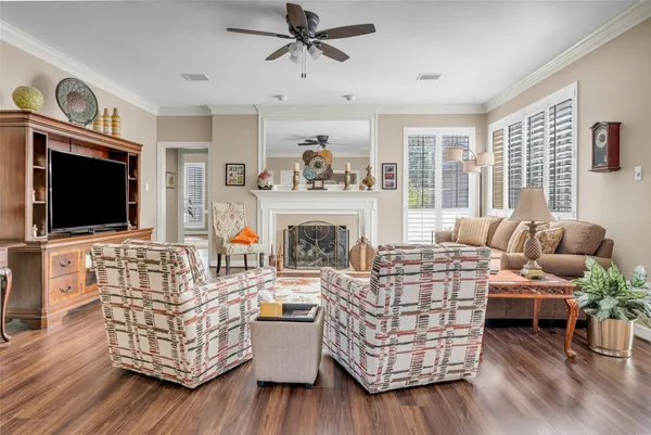 a living room with a baby crib furniture and a window