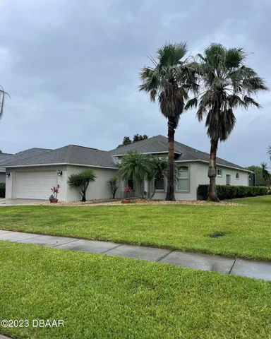 a kitchen with stainless steel appliances granite countertop a sink and a stove