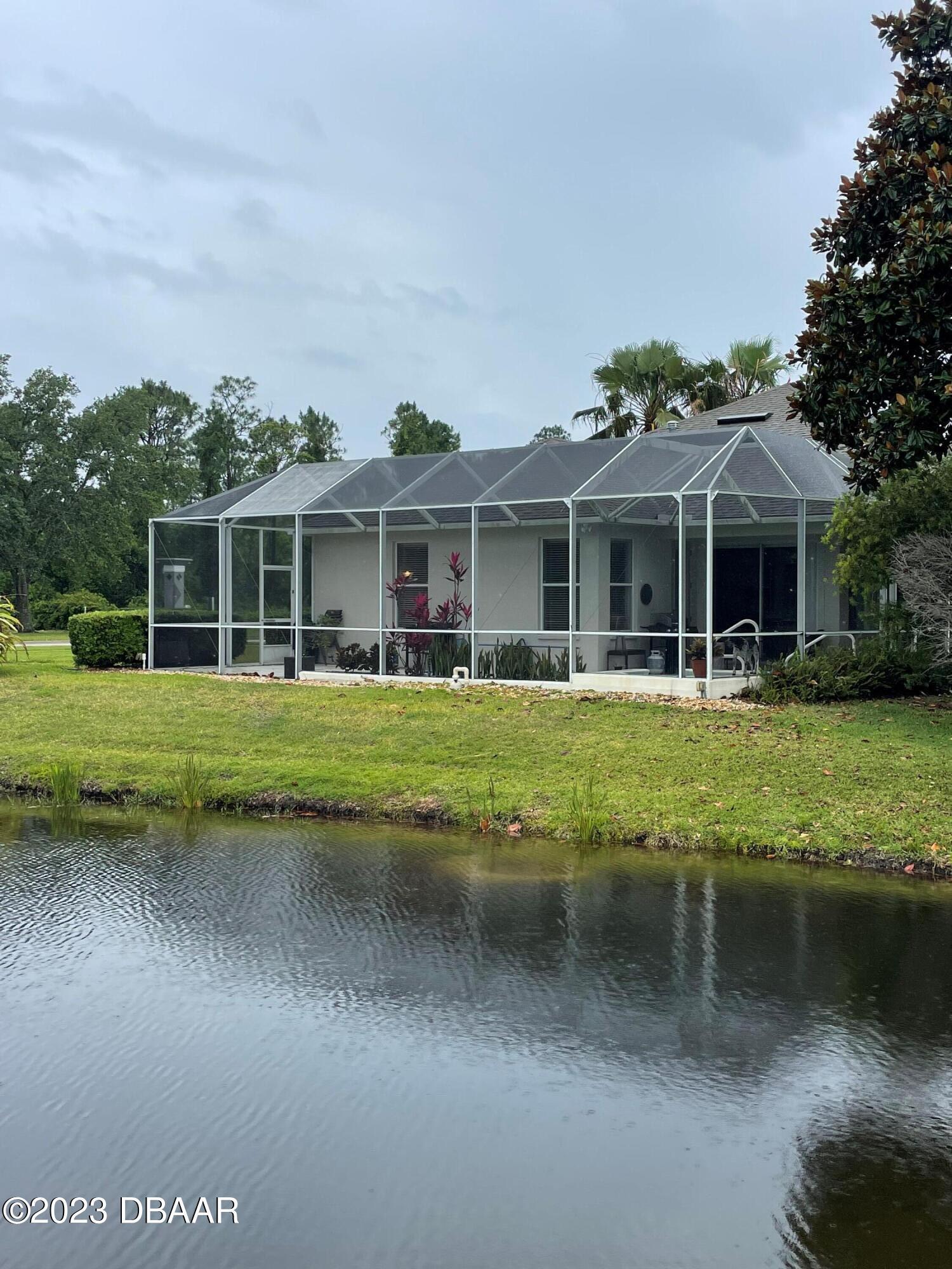 6129 Pheasant Ridge Drive Port Orange, FL 32128 - Photo 5 of 25 a front view of a house with a yard