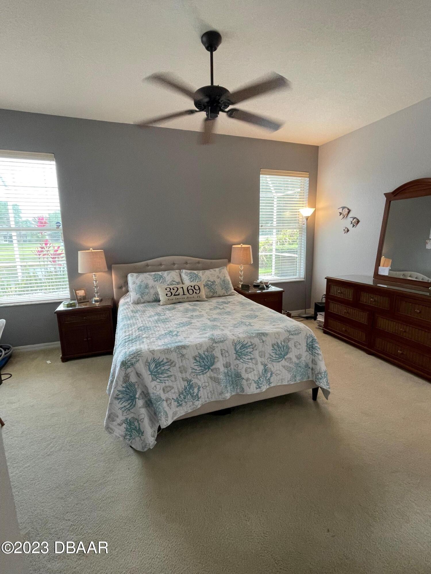6129 Pheasant Ridge Drive Port Orange, FL 32128 - Photo 9 of 25 a bedroom with a bed and window