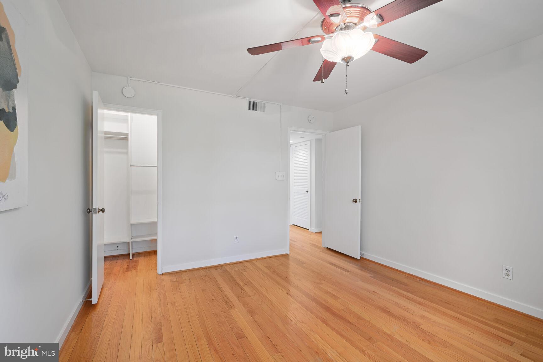 2242 Washington Avenue, Unit W303 Silver Spring, MD 20910 - Photo 16 of 37 wooden floor in an empty room with a window