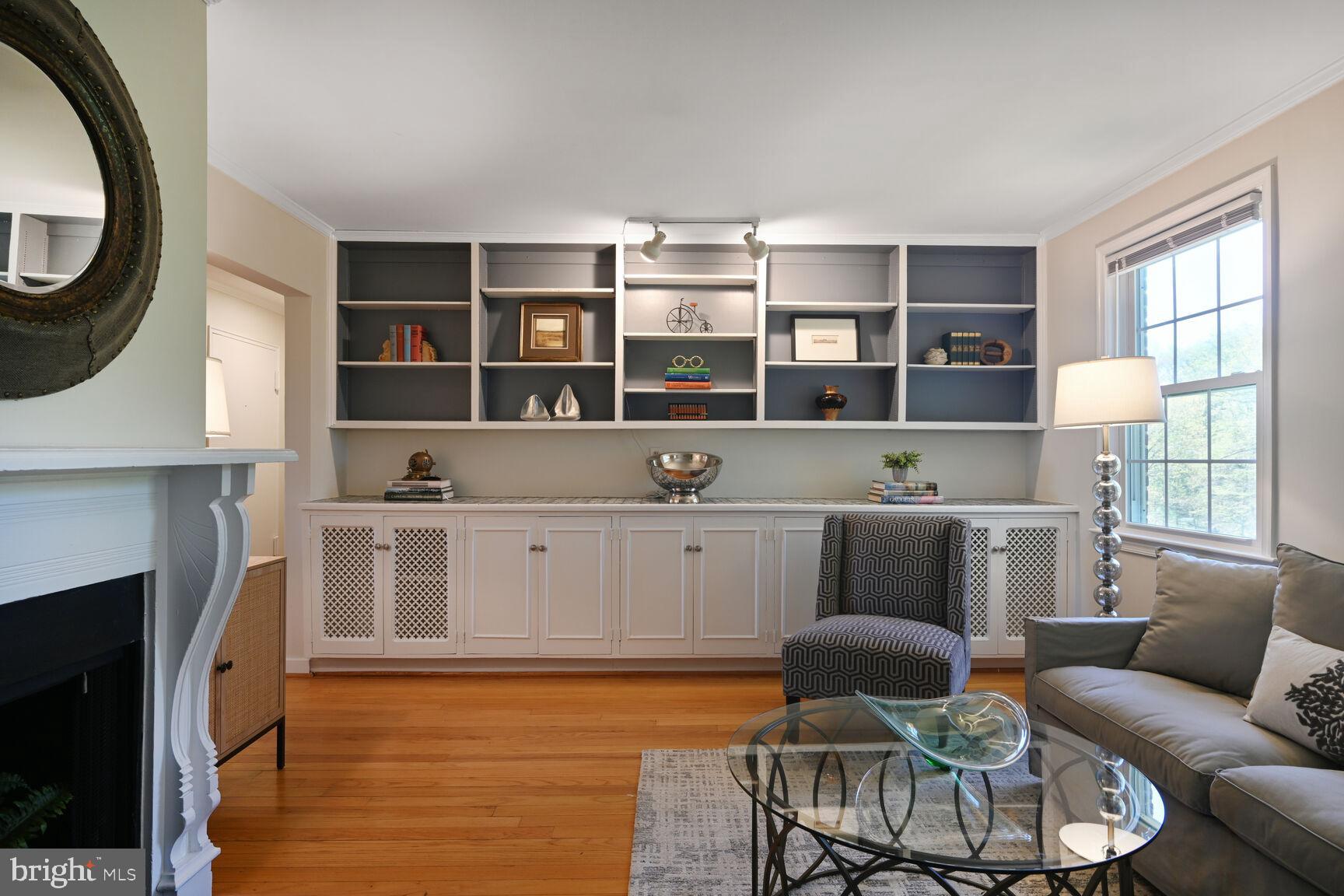 2242 Washington Avenue, Unit W303 Silver Spring, MD 20910 - Photo 7 of 37 a living room with furniture and a fireplace