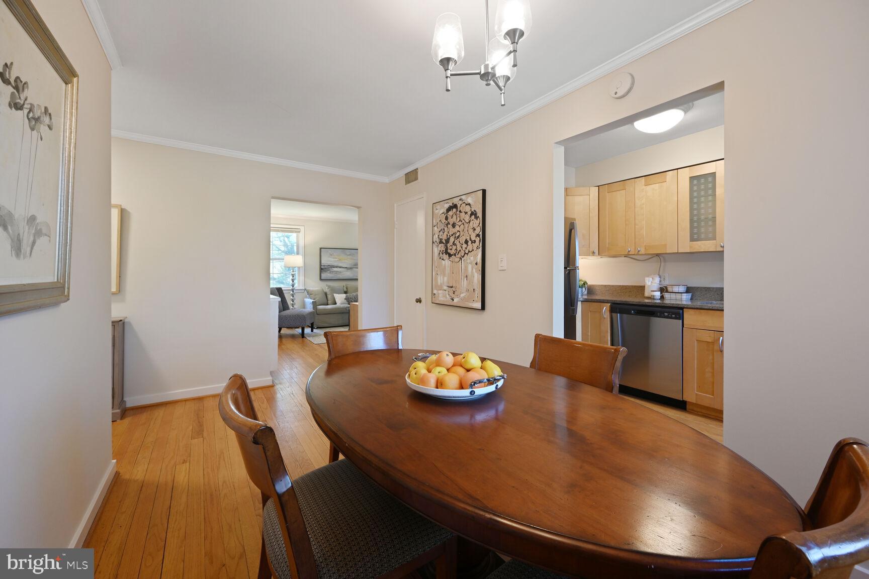 2242 Washington Avenue, Unit W303 Silver Spring, MD 20910 - Photo 10 of 37 a dining room with furniture and wooden floor
