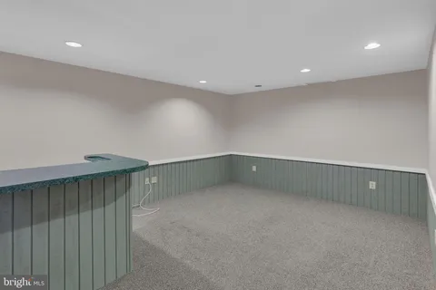 a white toilet sitting next to a shower curtain