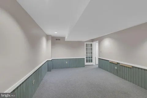 a house view with a sitting space and garden