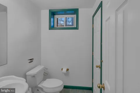 a front view of a building with a garden