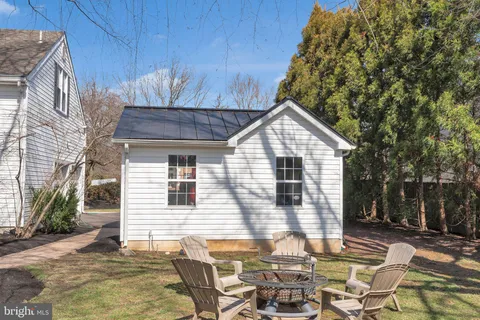 a picture of a bench in front of a gate