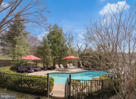 a view of a table and chairs under an umbrella