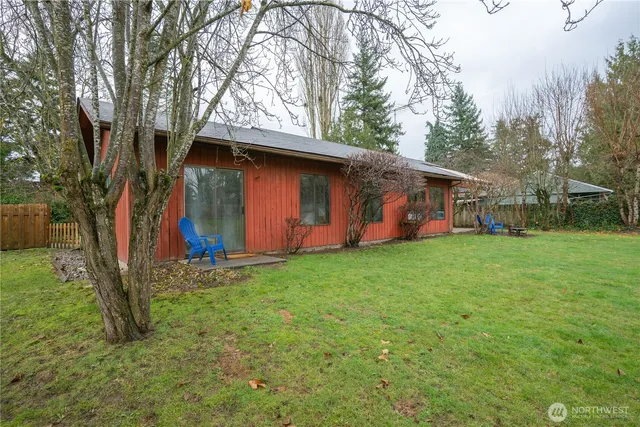 a backyard of a house with lots of green space