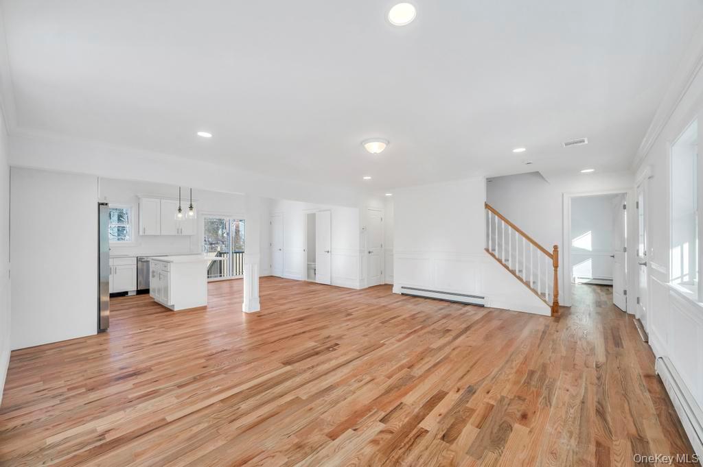 49 Barclay Road Mastic Beach, NY 11951 - Photo 11 of 33 a view of empty room with wooden floor