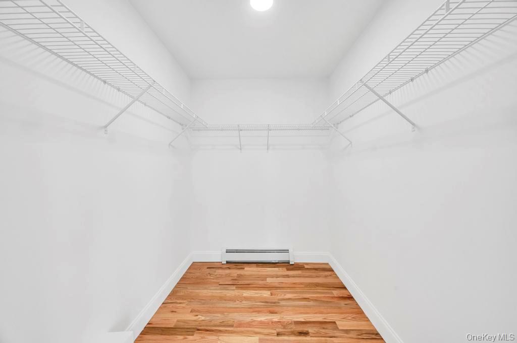 49 Barclay Road Mastic Beach, NY 11951 - Photo 23 of 33 a view of a room with racks on the wall