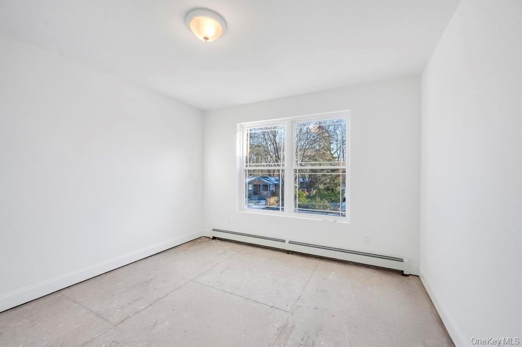 49 Barclay Road Mastic Beach, NY 11951 - Photo 24 of 33 an empty room with a window