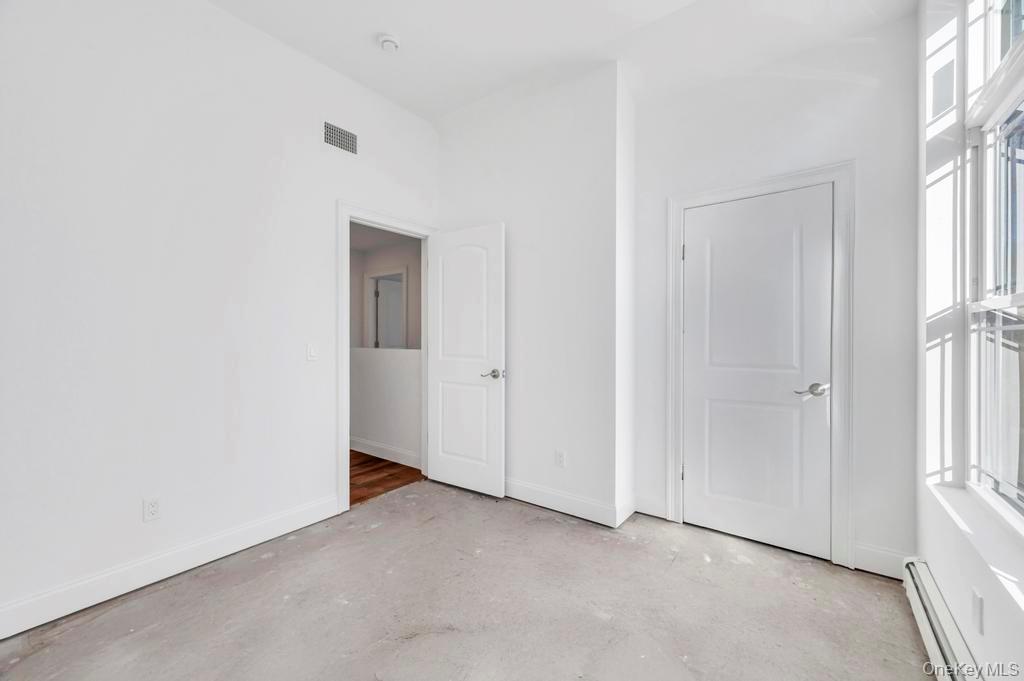 49 Barclay Road Mastic Beach, NY 11951 - Photo 27 of 33 an empty room with windows