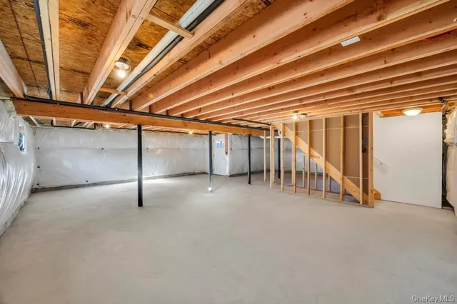 a view of a room with wooden ceiling