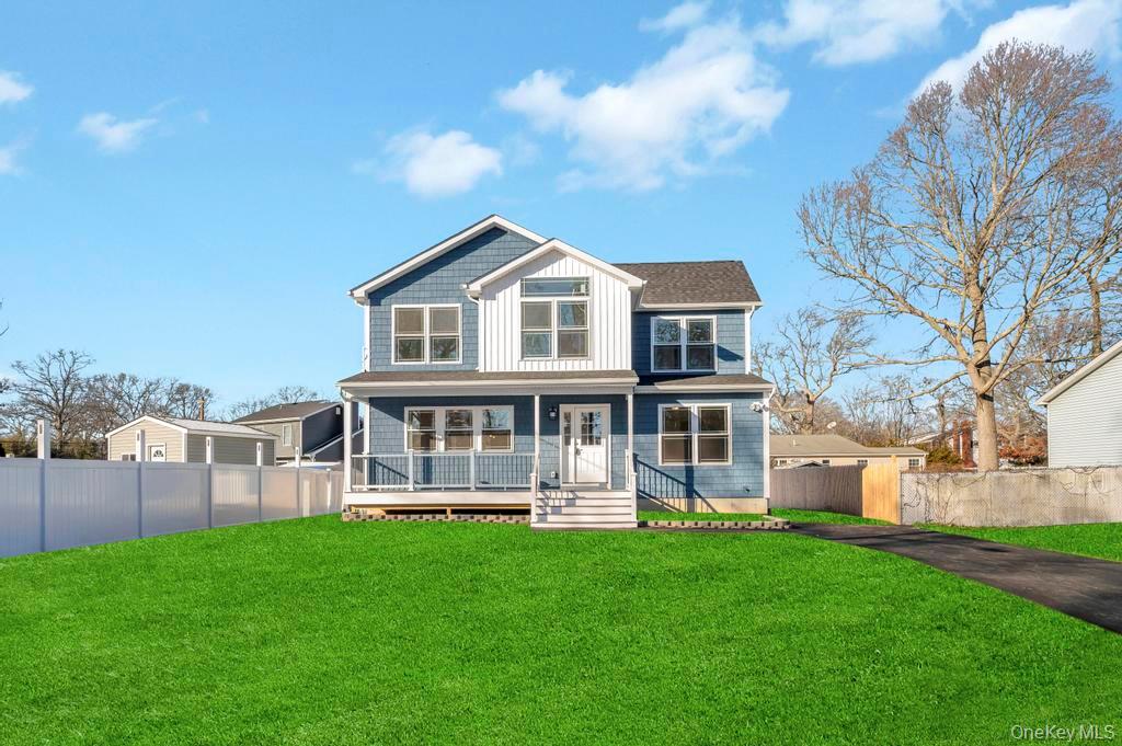 49 Barclay Road Mastic Beach, NY 11951 - Photo 4 of 33 a front view of a house with a yard
