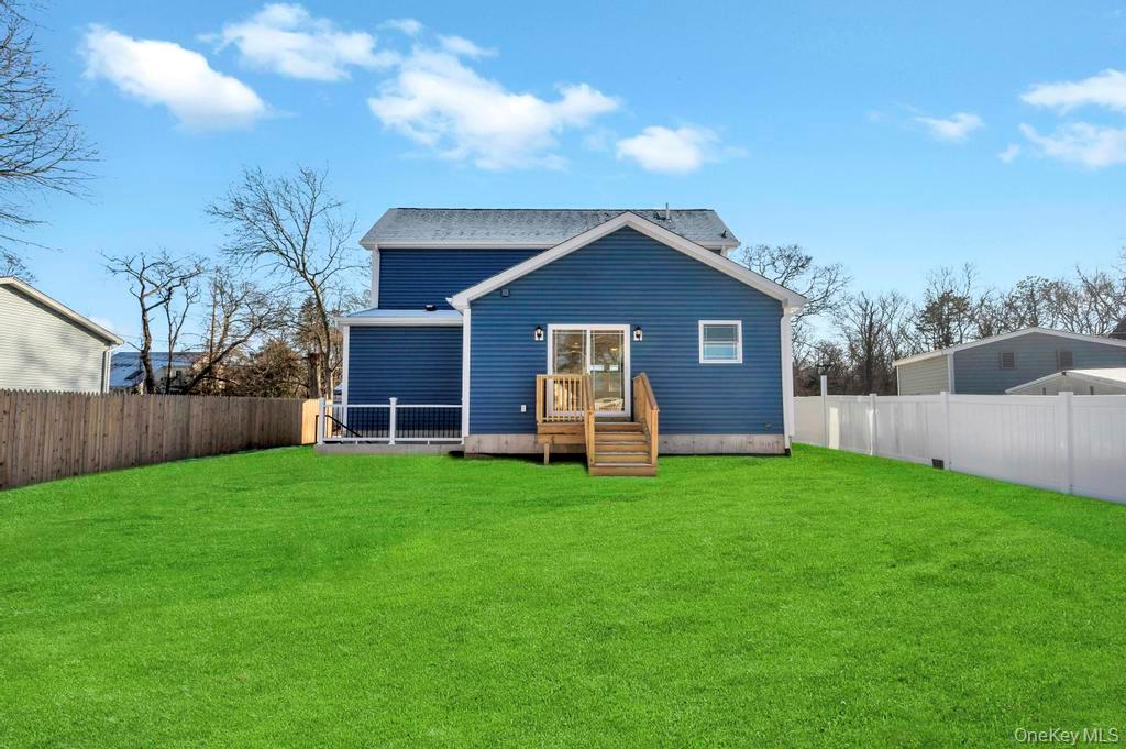 49 Barclay Road Mastic Beach, NY 11951 - Photo 6 of 33 a view of a house with a yard