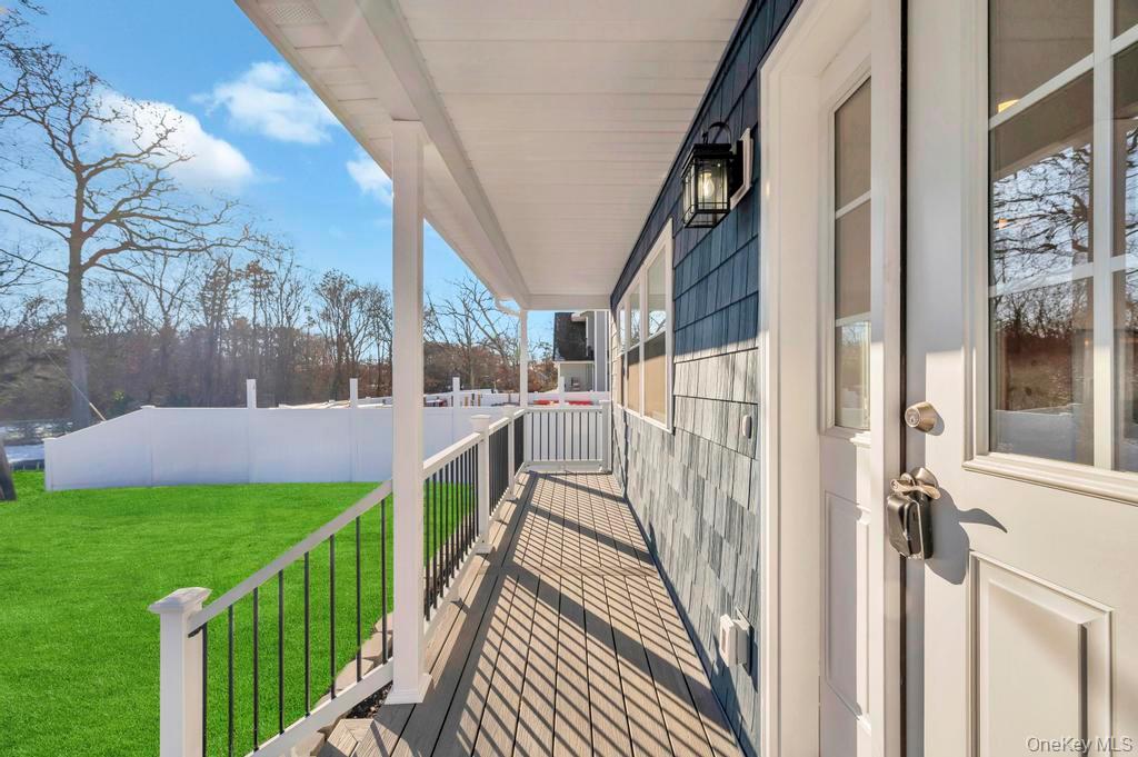 49 Barclay Road Mastic Beach, NY 11951 - Photo 8 of 33 a view of a house with a small yard