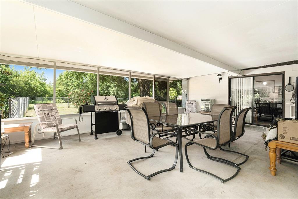 5960 Boyette Road Wesley Chapel, FL 33543 - Photo 21 of 32 a view of a dining room with furniture window and outside view