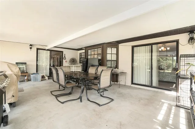 a view of a livingroom with furniture and a window