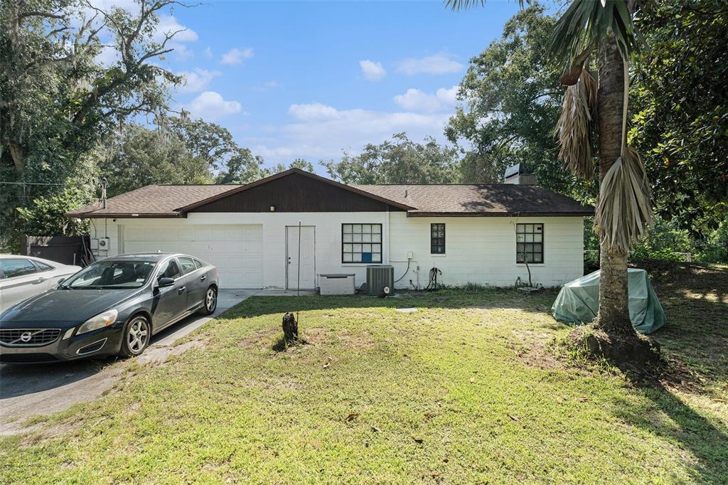 5960 Boyette Road Wesley Chapel, FL 33543 - Photo 23 of 32 a view of a house with a yard and sitting area