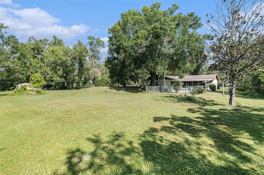 5960 Boyette Road Wesley Chapel, FL 33543 - Photo 28 of 32 a view of a house with a yard