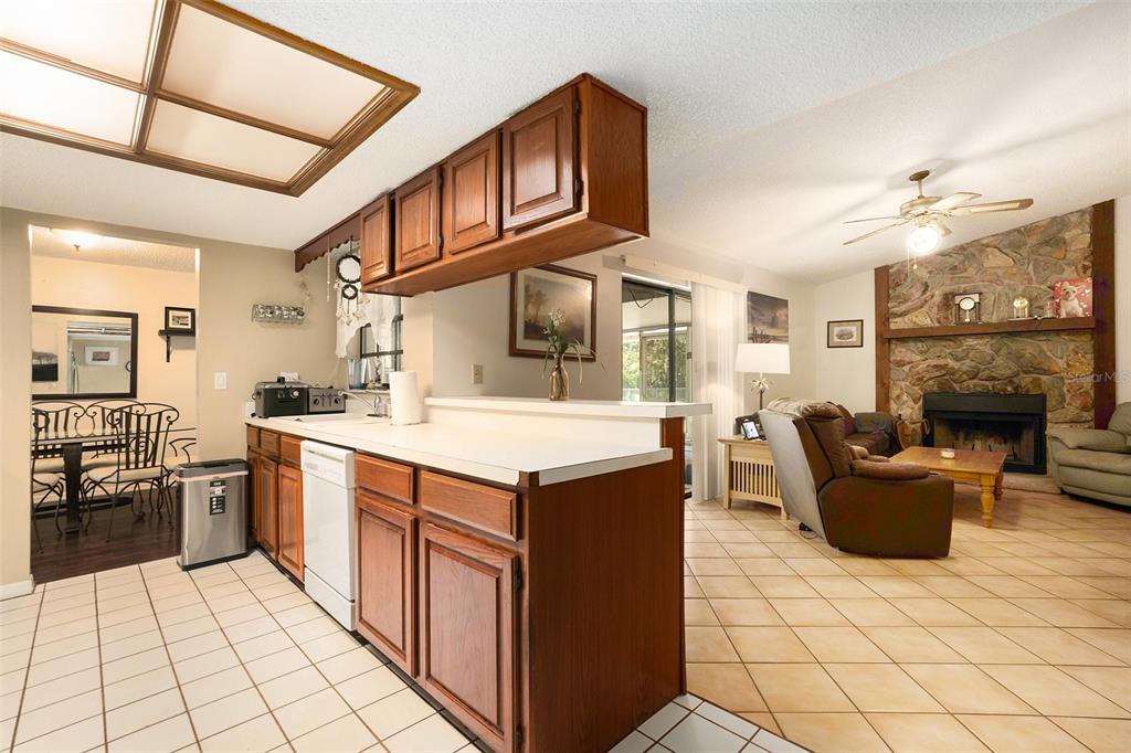 5960 Boyette Road Wesley Chapel, FL 33543 - Photo 10 of 32 a kitchen with stainless steel appliances granite countertop a stove a sink and a refrigerator