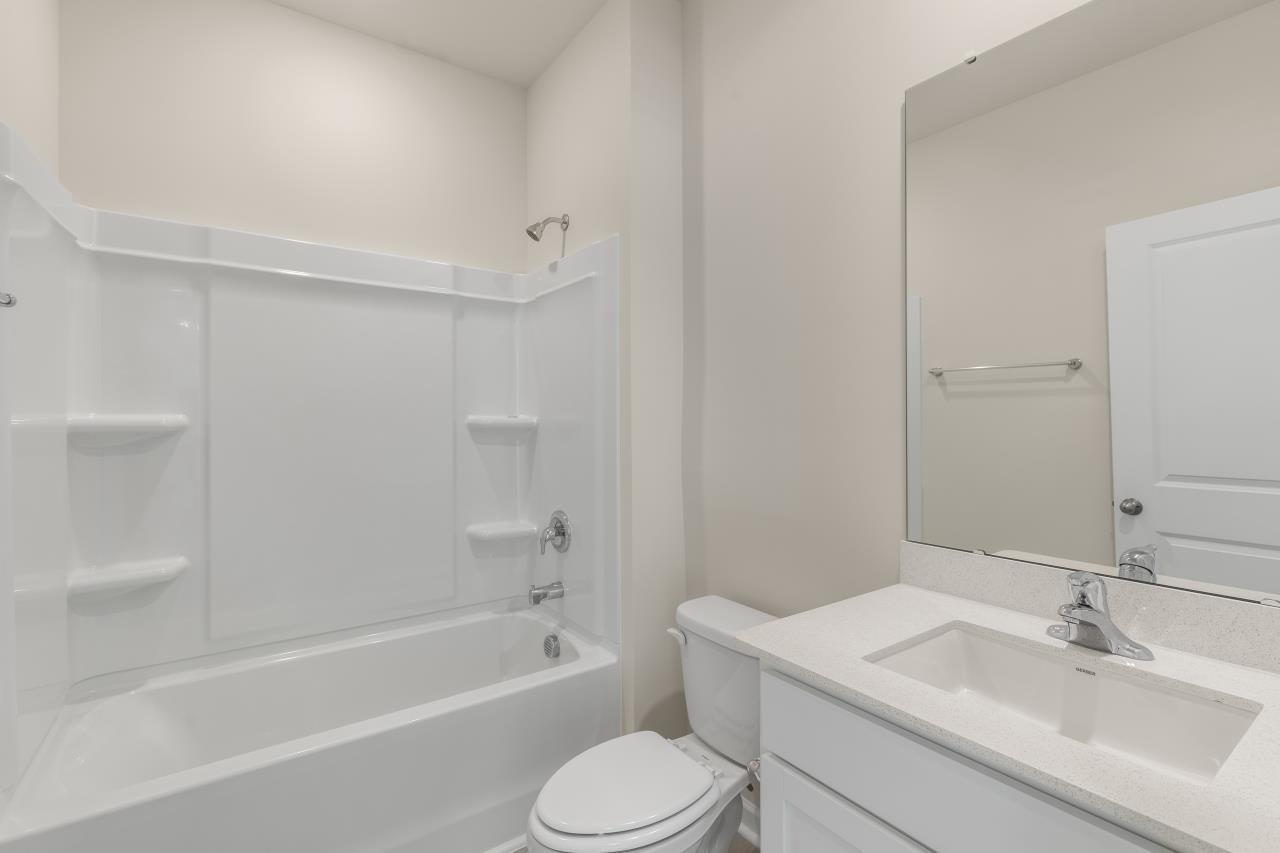 2129 Clydesmill Road Fayetteville, NC 28314 - Photo 22 of 37 a bathroom with a sink toilet and bathtub