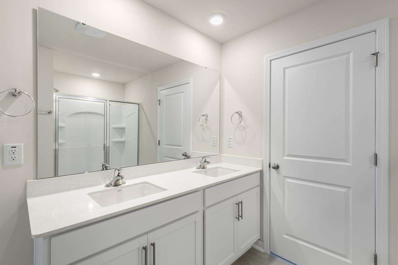2129 Clydesmill Road Fayetteville, NC 28314 - Photo 26 of 37 a bathroom with a sink double vanity and a mirror