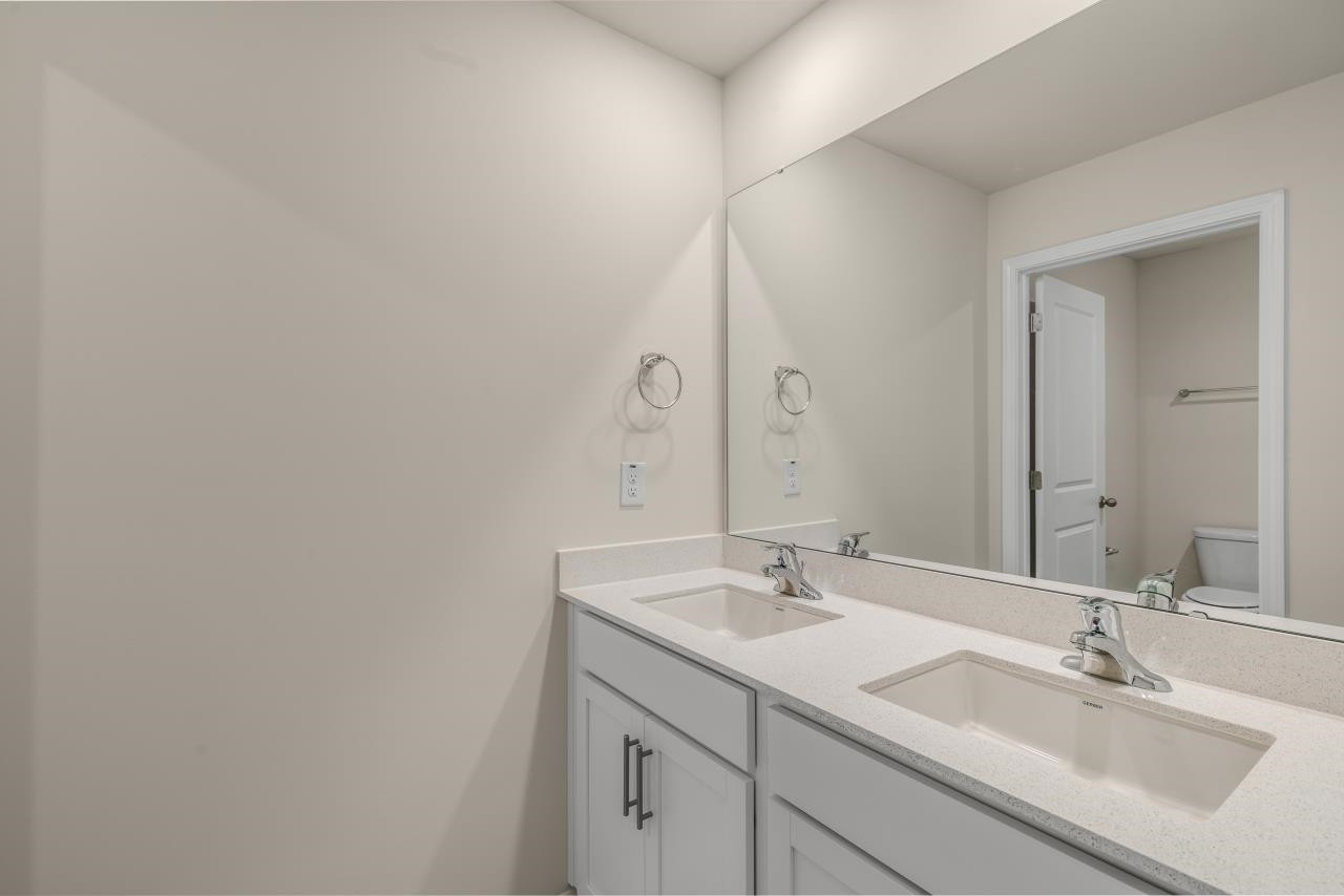 2129 Clydesmill Road Fayetteville, NC 28314 - Photo 33 of 37 a bathroom with a sink and a mirror