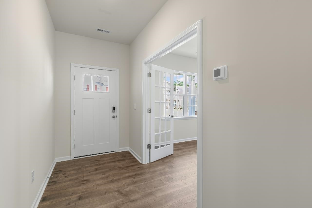 2129 Clydesmill Road Fayetteville, NC 28314 - Photo 7 of 37 a view of a hallway with wooden floor