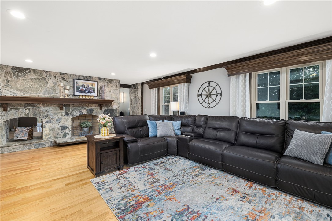 365 West Wrentham Road Cumberland, RI 02864 - Photo 19 of 50 Oversized formal living room shares a back to back fireplace with the den.