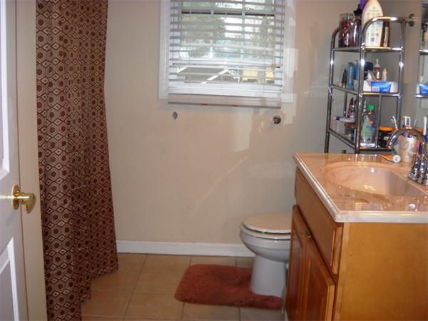 157 Cloran Street Springfield, MA 01109 - Photo 10 of 15 a bathroom with a sink toilet and window