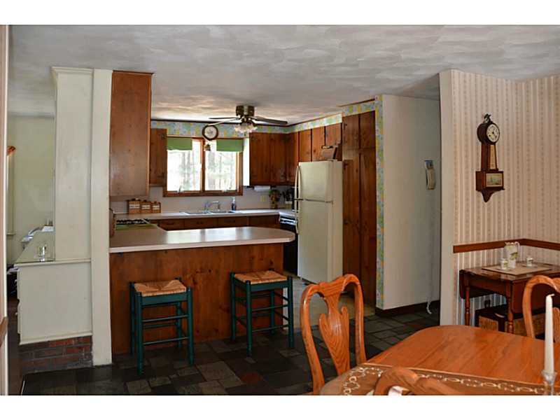 99 Stone Dam Road Glocester, RI 02857 - Photo 11 of 23 Kitchen. Dining and kitchen is open area with breakfast bar, real slate flooring.