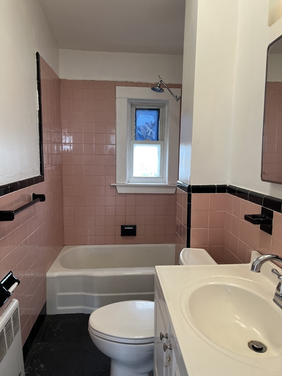 49 R Siren Street, Unit 3 Winthrop, MA 02152 - Photo 12 of 12 a bathroom with a sink a toilet and shower
