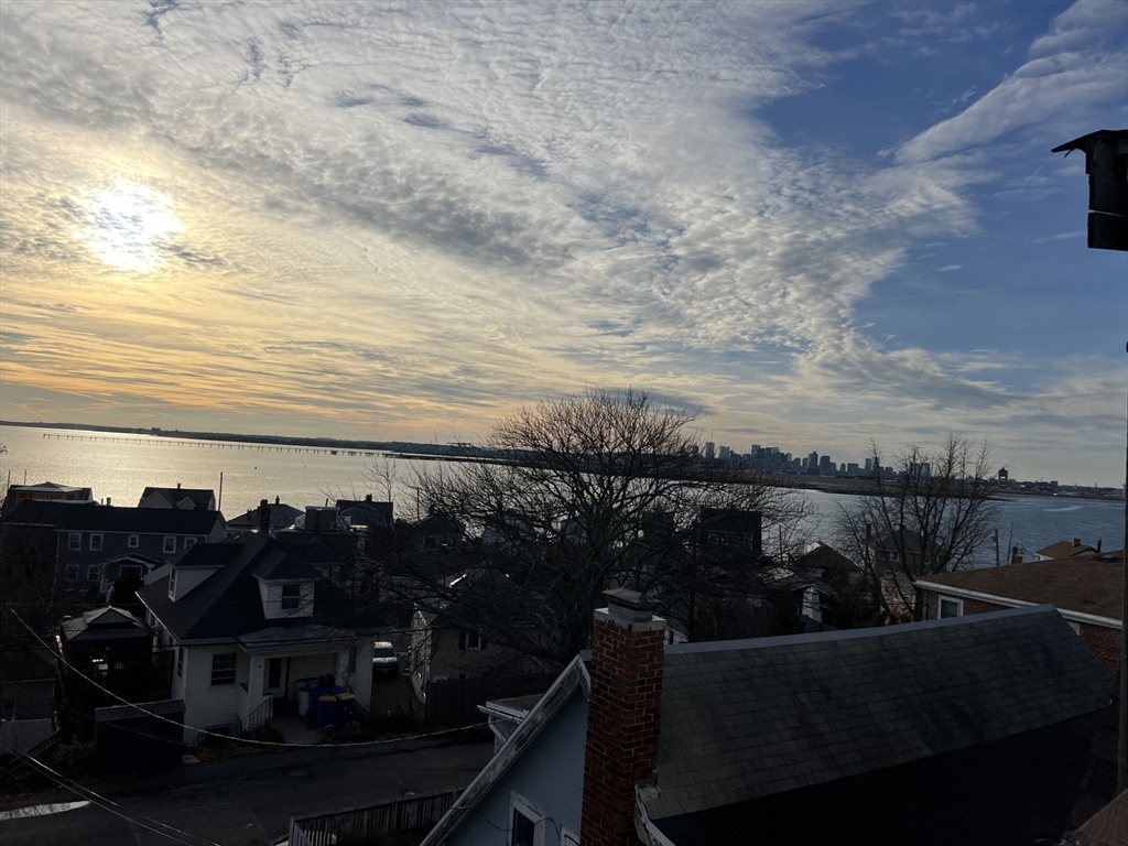 49 R Siren Street, Unit 3 Winthrop, MA 02152 - Photo 2 of 12 a view of a balcony and ocean view