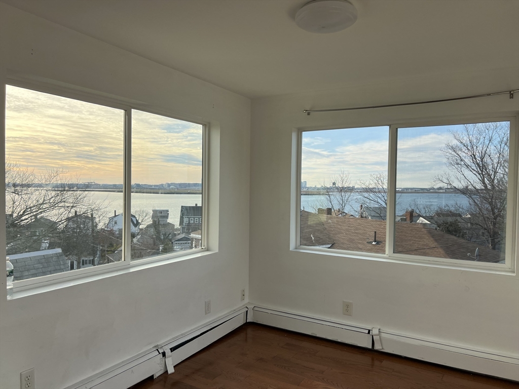 49 R Siren Street, Unit 3 Winthrop, MA 02152 - Photo 5 of 12 a view of empty room with window