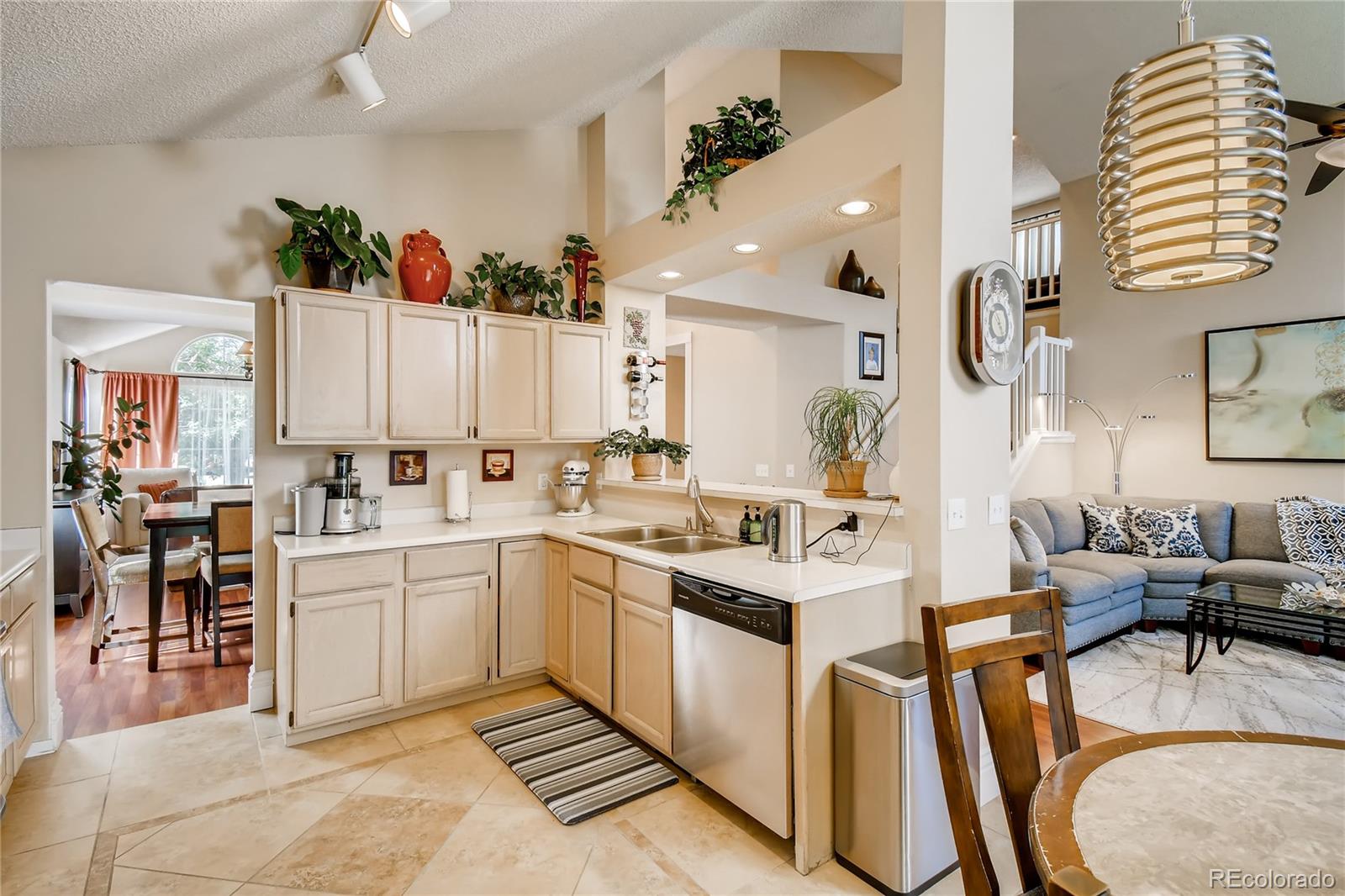 9879 Concord Court Highlands Ranch, CO 80130 - Photo 8 of 36 a large white kitchen with lots of appliances