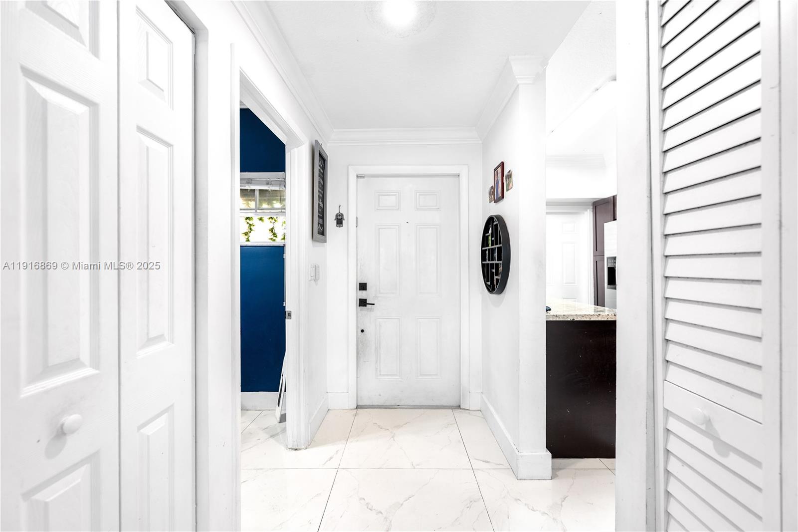 9985 Southwest 118th Place Miami, FL 33186 - Photo 13 of 30 a view of entryway and hall with wooden floor