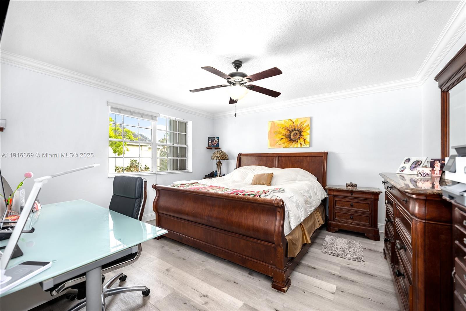 9985 Southwest 118th Place Miami, FL 33186 - Photo 22 of 30 a bedroom with a bed and a desk